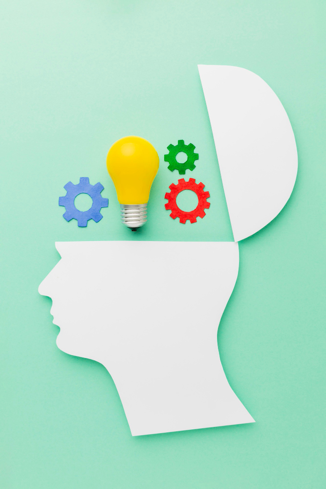 Illustration of an open head with a light bulb and gears